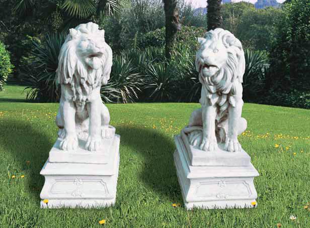 Lions statues standin on bases in marble and cast stone 